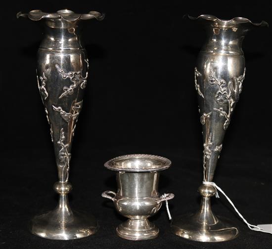 A pair of early 20th century Chinese Export silver posy vases by Wang Hing, Hong Kong, 8in, and a small sterling vase.